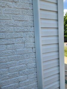 siding installation alongside different materials